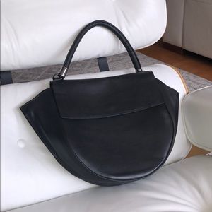 Structured black leather handbag by Lia Numa.